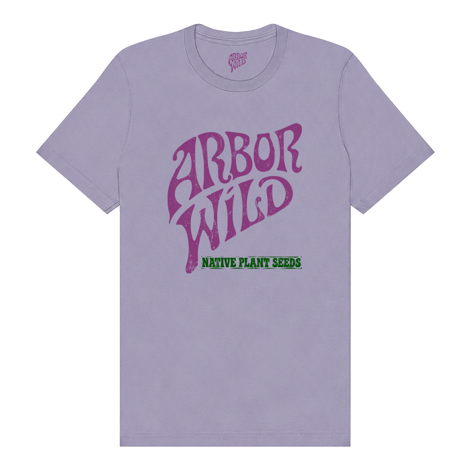 A light purple crewneck t-shirt featuring a stylized purple 'ARBOR WILD' logo on the chest with 'NATIVE PLANT SEEDS' printed in green underneath.